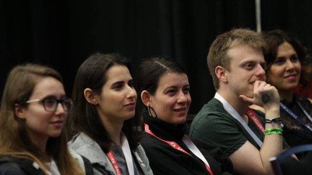 SXSW attendees listen to programming on the SXSW Job Market Stage.