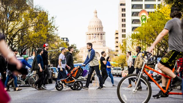 People crossing Congress with view of capital building - Photo by Aaron Rogosin