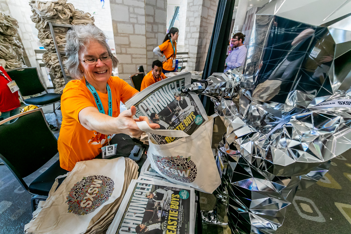 Hitchhiker picks up an Austin Chronicle and Big Bag. Photo by Aaron Rogosin