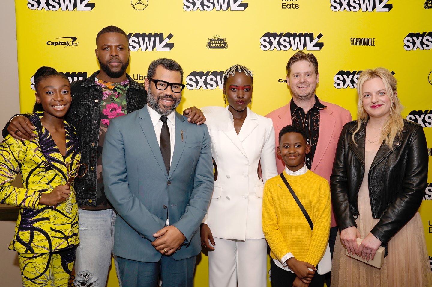 (L-R) Shahadi Wright Joseph, Winston Duke, Jordan Peele, Lupita Nyong'o, Evan Alex, Tim Heidecker, and Elisabeth Moss attend the Us world premiere at the Paramount Theatre - Photo by Ismael Quintanilla/Getty Images for SXSW