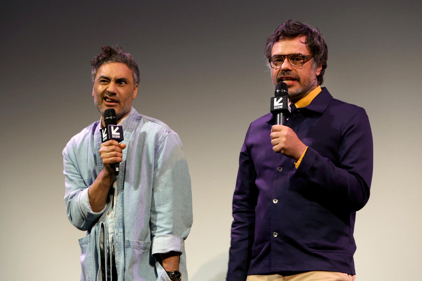 Taika Waititi and Jemaine Clement speak onstage at the What We Do in the Shadows world premiere at the Paramount Theatre. Photo by Travis P Ball/Getty Images for SXSW