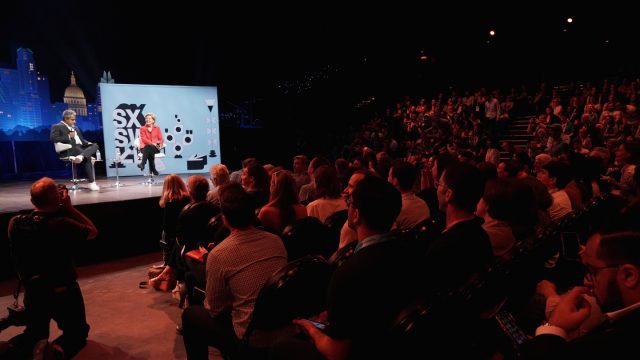 Anand Giridharadas (L) and Elizabeth Warren speak onstage at the Conversations About America's Future series at Austin City Limits Live at the Moody Theater - Photo by Amy E. Price/Getty Images for SXSW