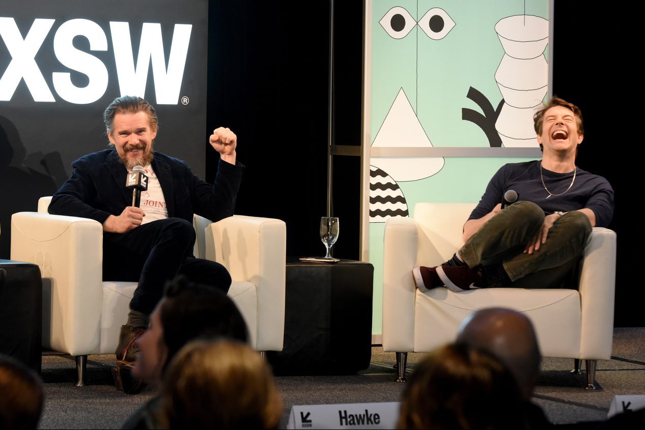 Ethan Hawke and Jason Blum speak onstage at their Featured Session.