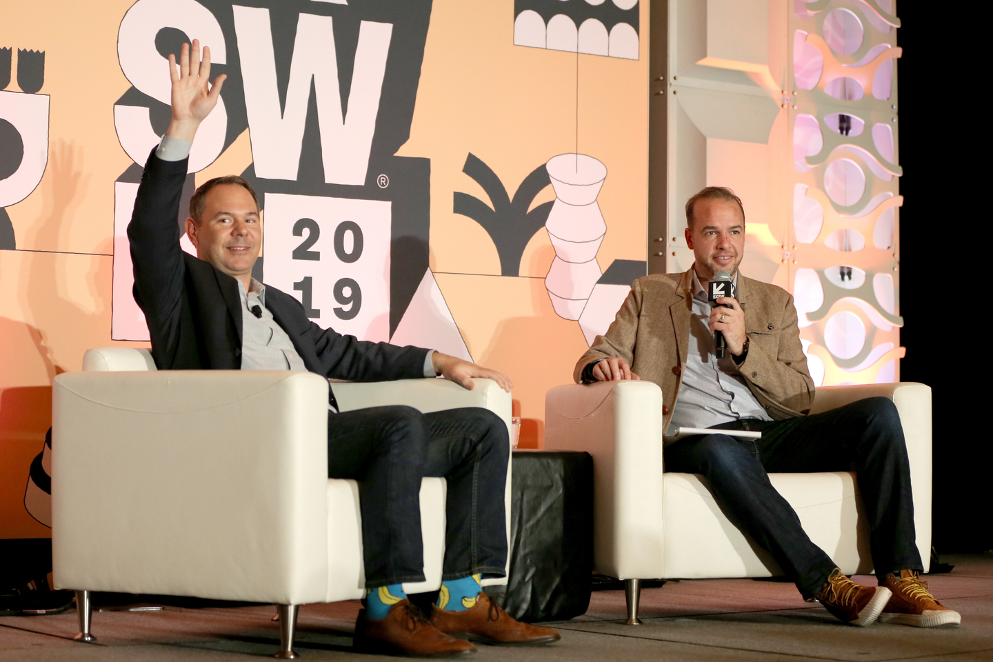 Troy Dayton and David Downs speak onstage at the Hilton Austin.