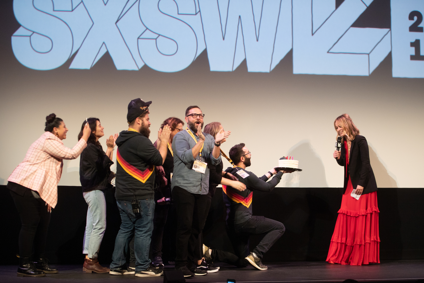 The SXSW Film Staff present Olivia Wilde with a birthday cake while she attends the Booksmart Premiere at the Paramount Theatre.