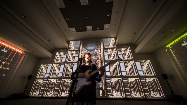 Stella Donnelly performs for NPR’s SXSW Lullabys in front of the Conductors and Resistance installation by Ronen Sharabani, part of the SXSW Art Program, is on display through Saturday in Room 3 at the Austin Convention Center.