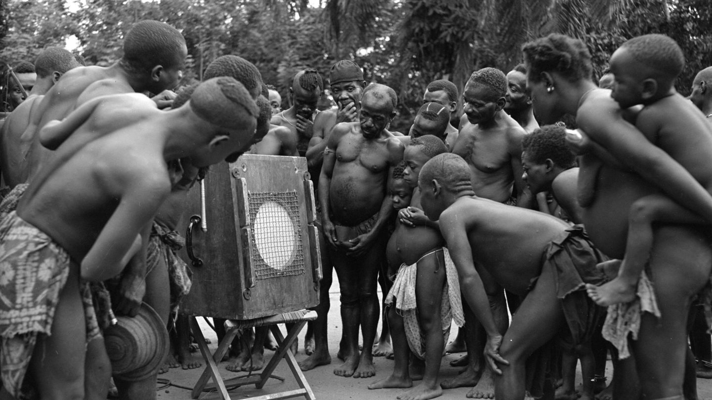 In this 1952 photo that inspired Beating Heart’s creation, Mbuti Pygmies listen to a recording of their own music made by ethnomusicologist Hugh Tracey. Photo courtesy of Chris Pedley.