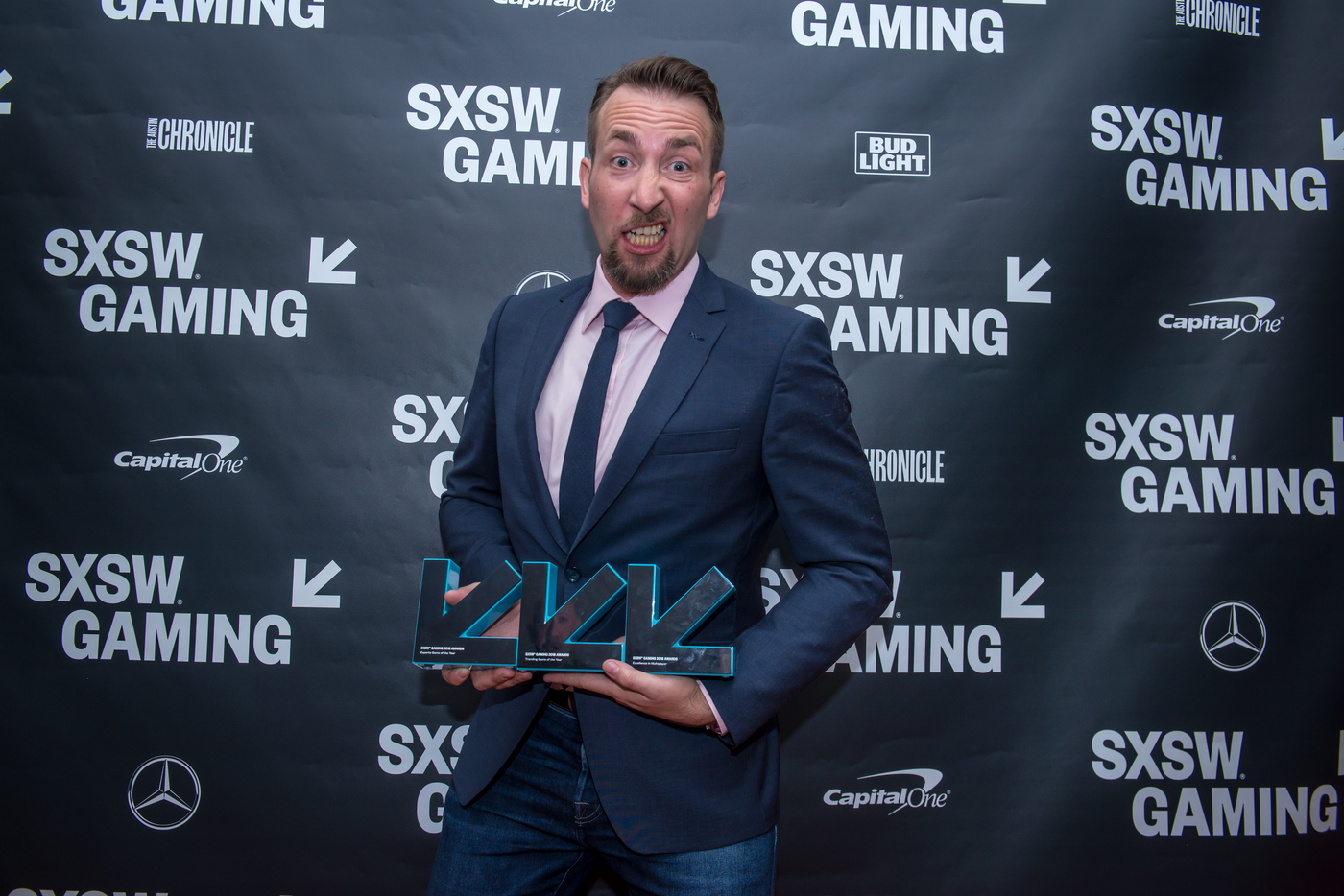 Brendan Greene with awards for Esports Game of the Year, Trending Game of the Year and Excellence in Multiplayer. Photo by Amanda Stronza