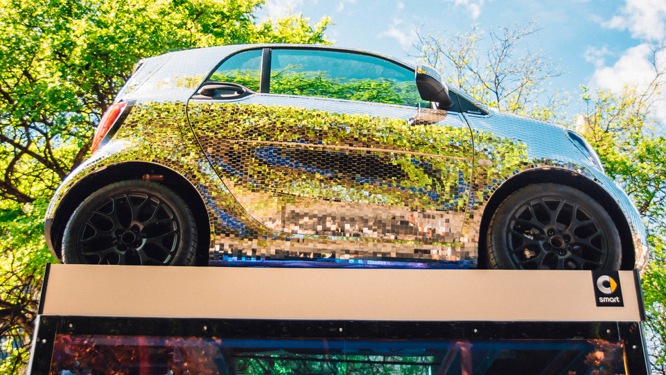 The smart fortwo disco ball has been installed at the corner of 6th and Trinity. Photo by Jordan Hefler