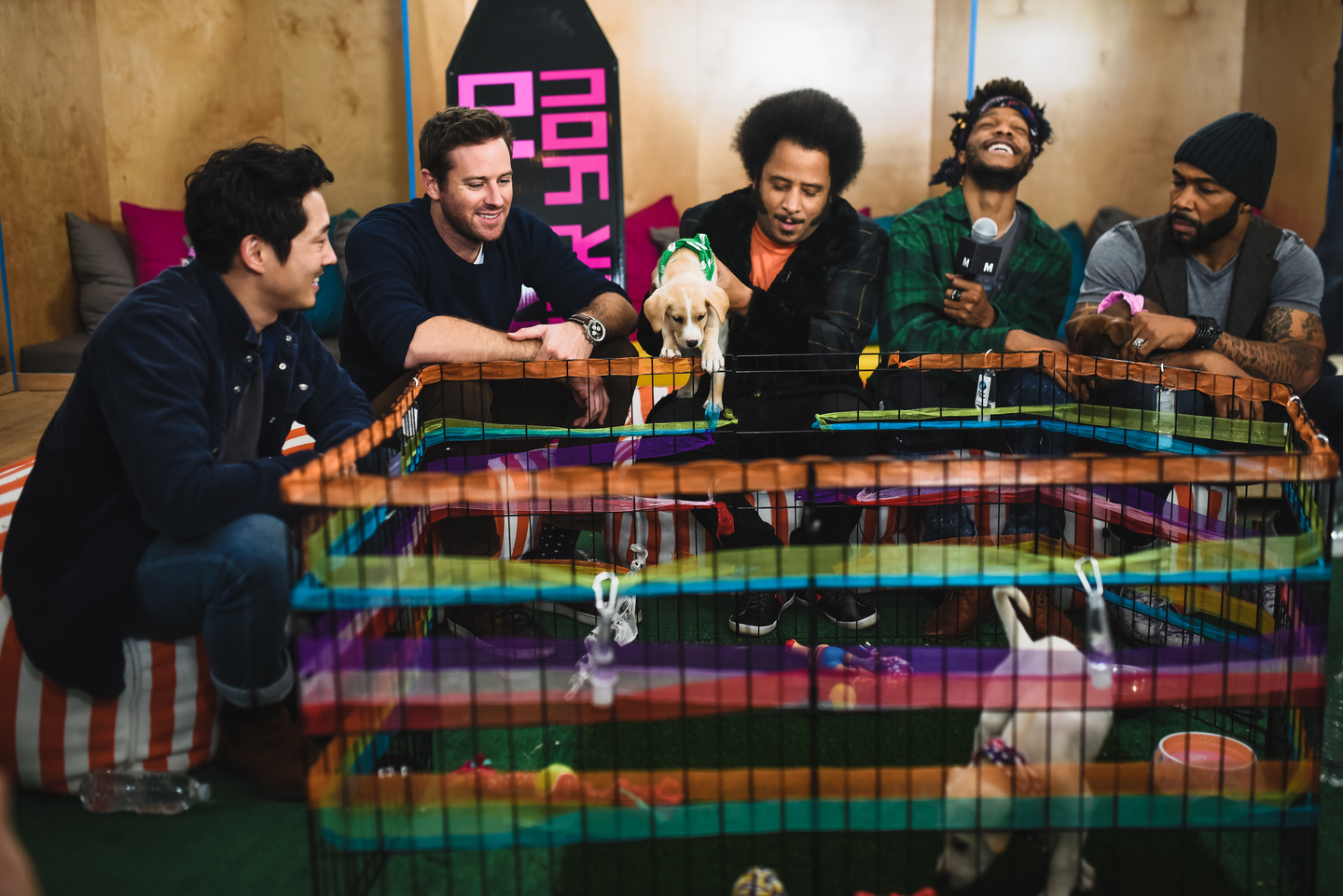(L-R) Steven Yeun, Armie Hammer, Boots Riley, Jermaine Fowler and Omari Hardwick of the film Sorry To Bother You stopped by Mashable House: Time Warp to visit puppies brought by The Austin Humane Society. Photo by Judy Won