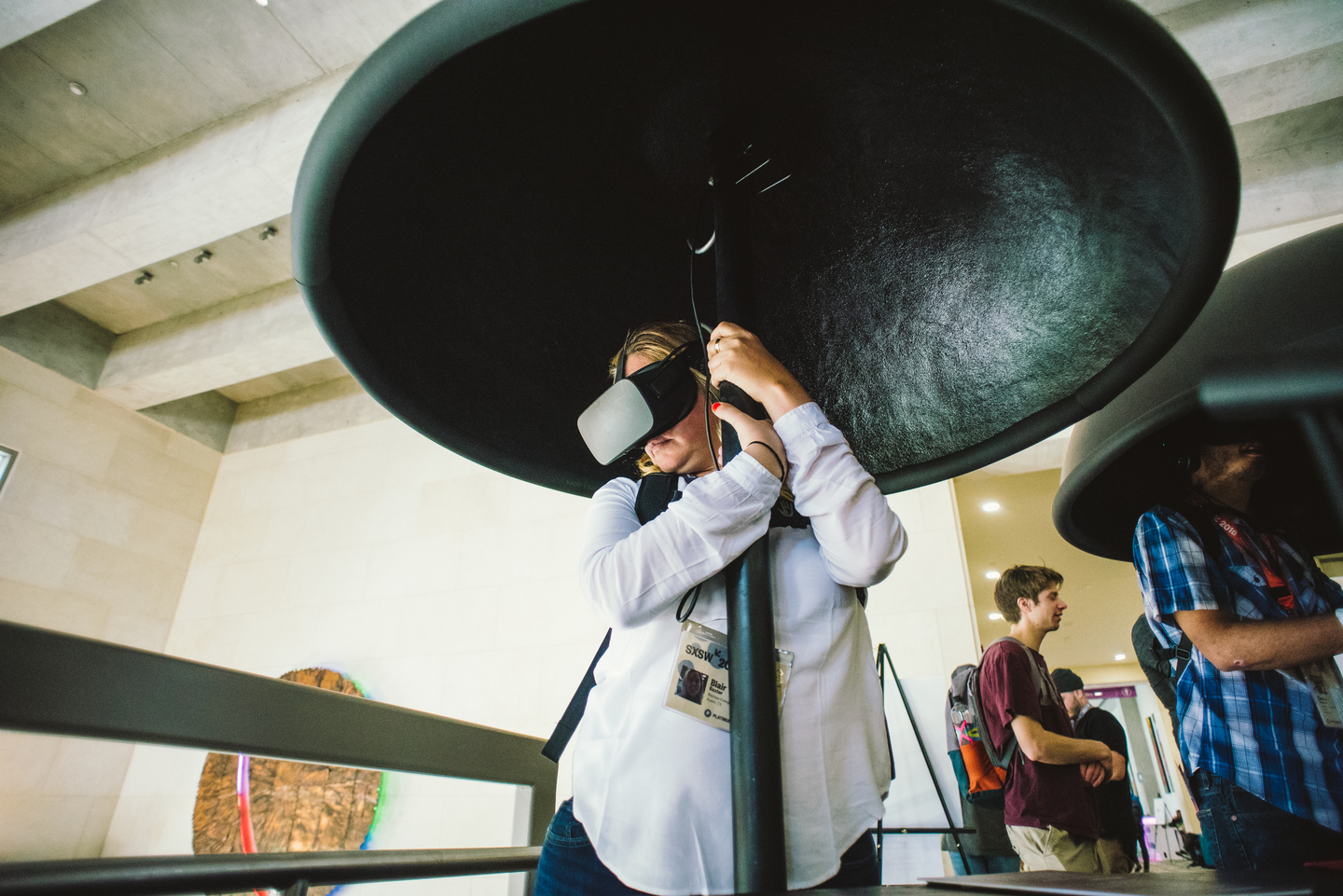 A visitor to the “A Colossal Wave” VR art exhibit at the Austin Convention Center. Photo by Letitia Smith