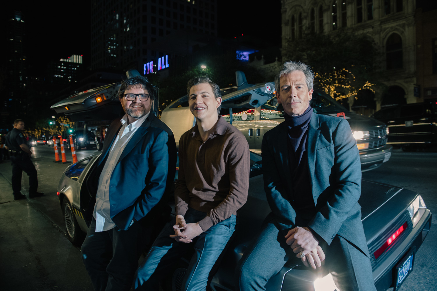 Ernie Cline, Tye Sheridan and Ben Mendelsohn on Cline's DeLorean in front of the Paramount Theatre at the World Premiere of Ready Player One. Photo by Danny Matson