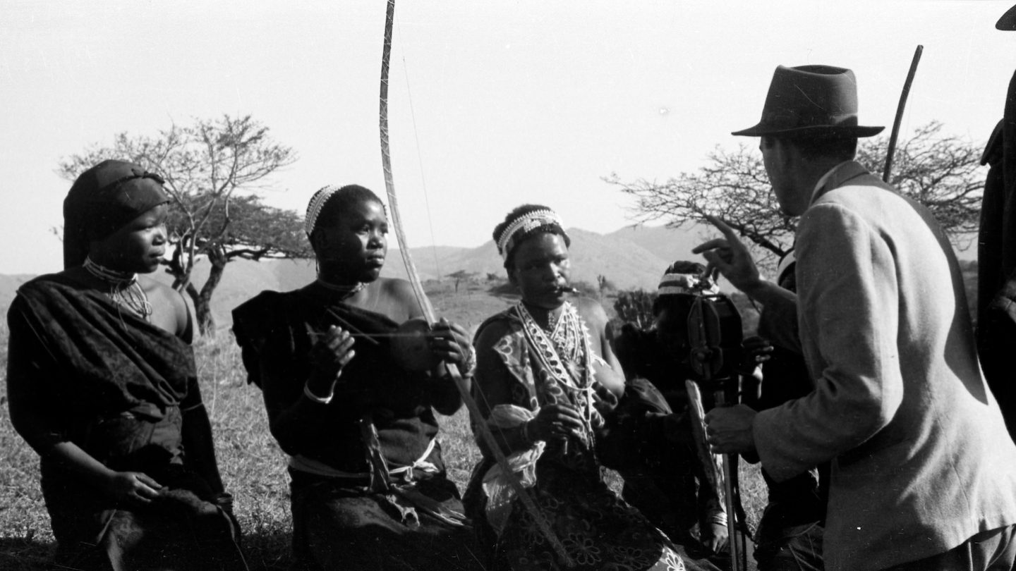 In this 1952 photo that inspired Beating Heart’s creation, Mbuti Pygmies listen to a recording of their own music made by ethnomusicologist Hugh Tracey. Photo courtesy of Chris Pedley.