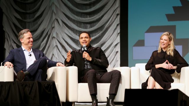 (L-R) Jake Tapper, Trevor Noah, and Desi Lydic speak onstage at Featured Session: The Daily Show with Trevor Noah. Photo by Travis P Ball/Getty Images for SXSW