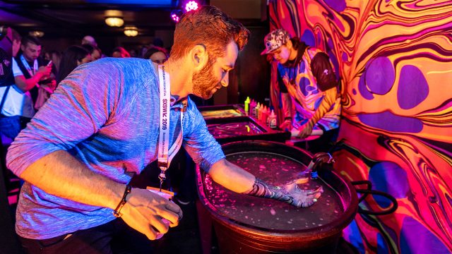 An attendee at the Interactive Opening Party presented by MOON Selfie during SXSW 2019. Photo by Merrick Ales. An attendee at the Interactive Opening Party presented by MOON Selfie during SXSW 2019. Photo by Merrick Ales.