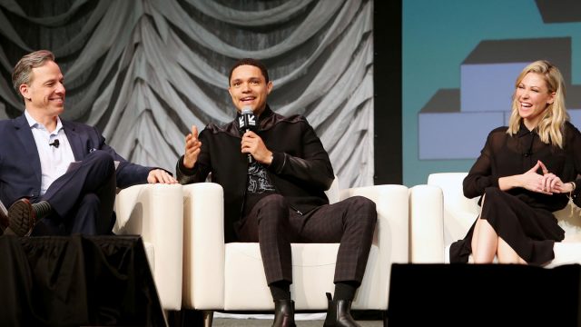 Jake Tapper, Trevor Noah, and Desi Lydic speak onstage during Featured Session: The Daily Show with Trevor Noah - SXSW 2019. Photo by Travis P Ball/Getty Images for SXSW