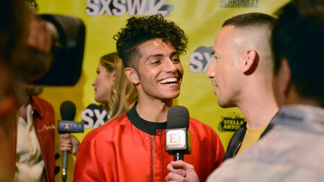 Mena Massoud attends the premiere of 