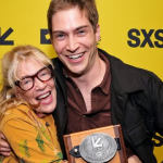 Deborah Morosini and James Morosini pose with the Narrative Feature Competition Award for ‘I Love My Dad’ – SXSW 2022 – Rich Fury/Getty Images for SXSW