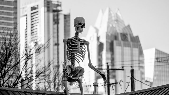 The Austin Skyline Behind A Skeleton At SXSW 2023 - Photo by Adam Kissick