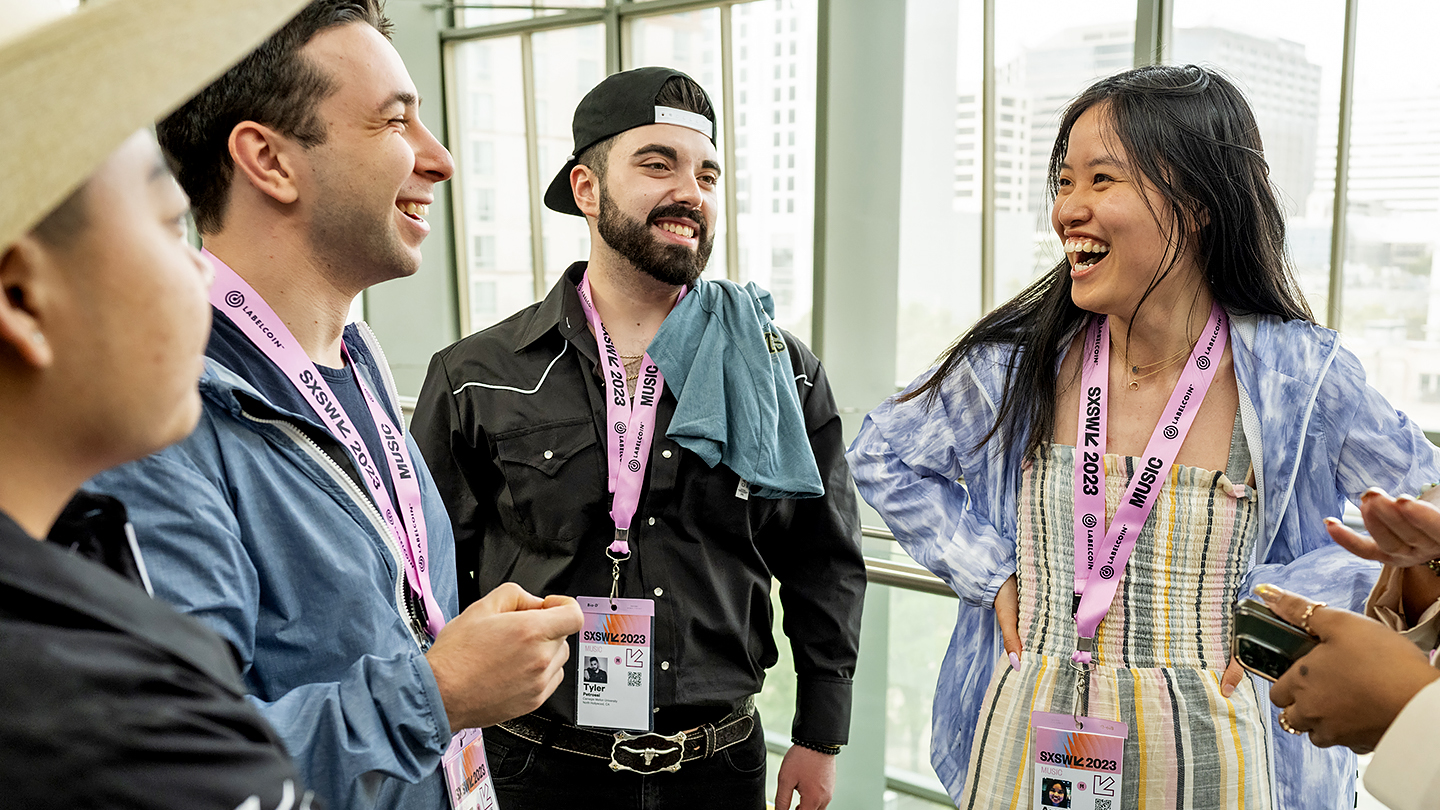 Group with Interactive Badge at 2023 SXSW - Photo by Tico Mendoza