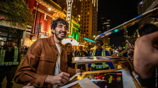 Dev Patel signs autographs before the World Premiere of Monkey Man at SXSW 2024 - Photo by Aaron Rogosin